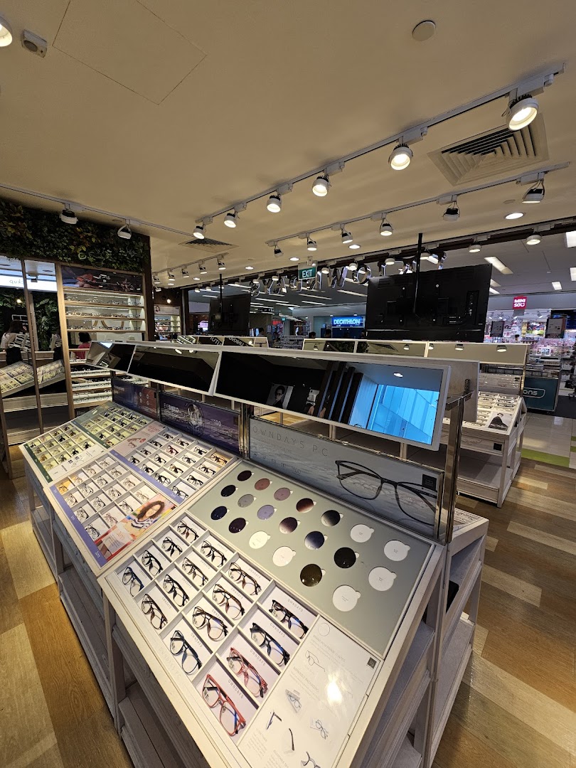 Interior view of OWNDAYS eyewear store, showcasing various glasses displays and a wide selection of frames.