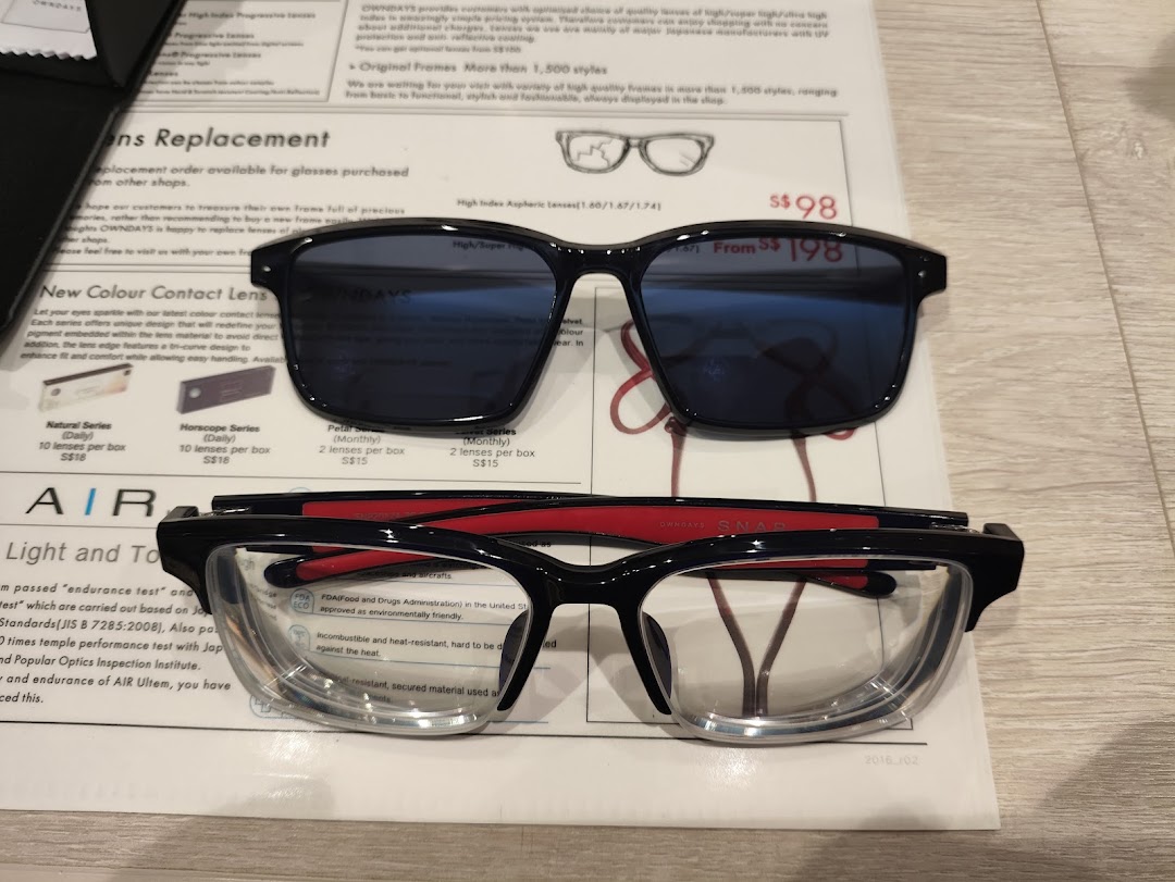 Close-up of OWNDAYS eyeglasses, sunglasses, and informational documents detailing lens options and contact lenses.
