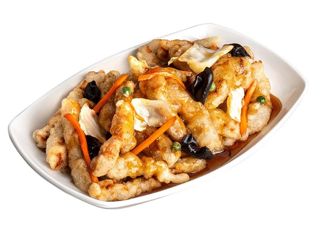 A white rectangular dish filled with golden-brown fried meat, carrots, wood ear mushrooms, and cabbage in a sauce.