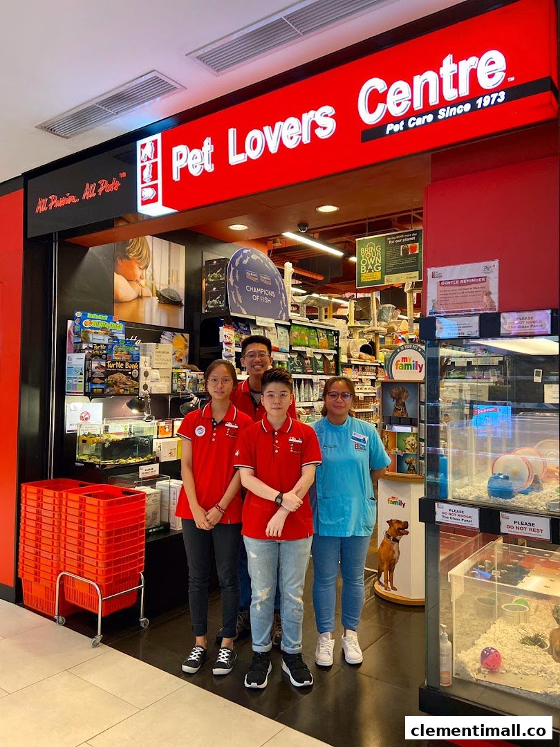 The storefront of Pet Lovers Centre with staff members and pet supplies visible inside.