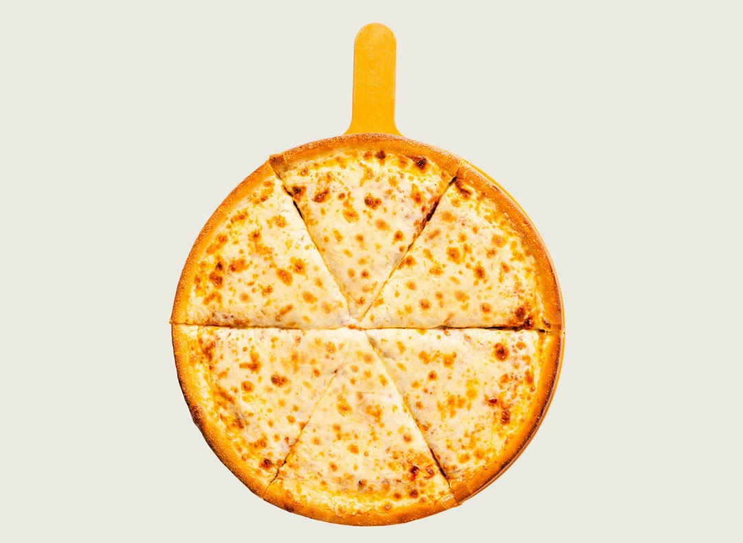 A delicious cheese pizza, sliced and ready to serve on a pizza peel.