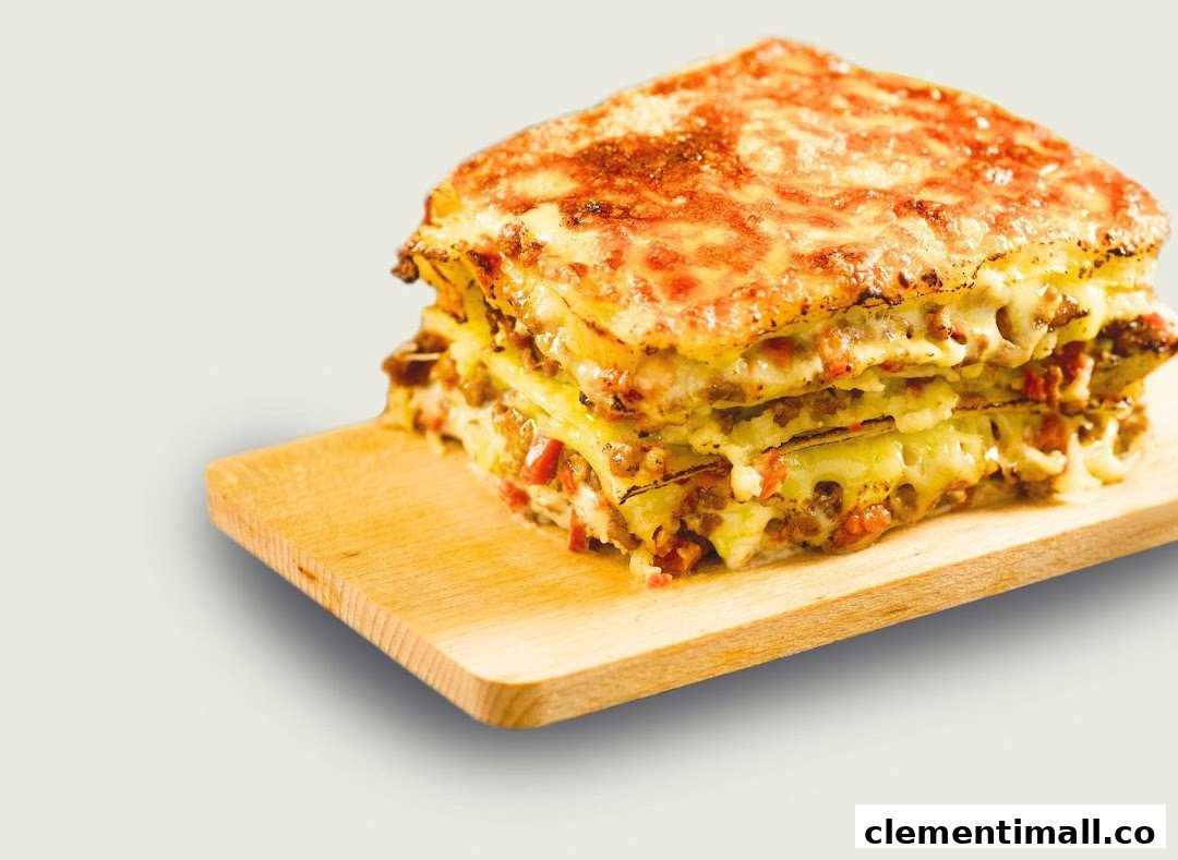 A delicious, multi-layered lasagna with melted cheese and meat sauce on a wooden board.
