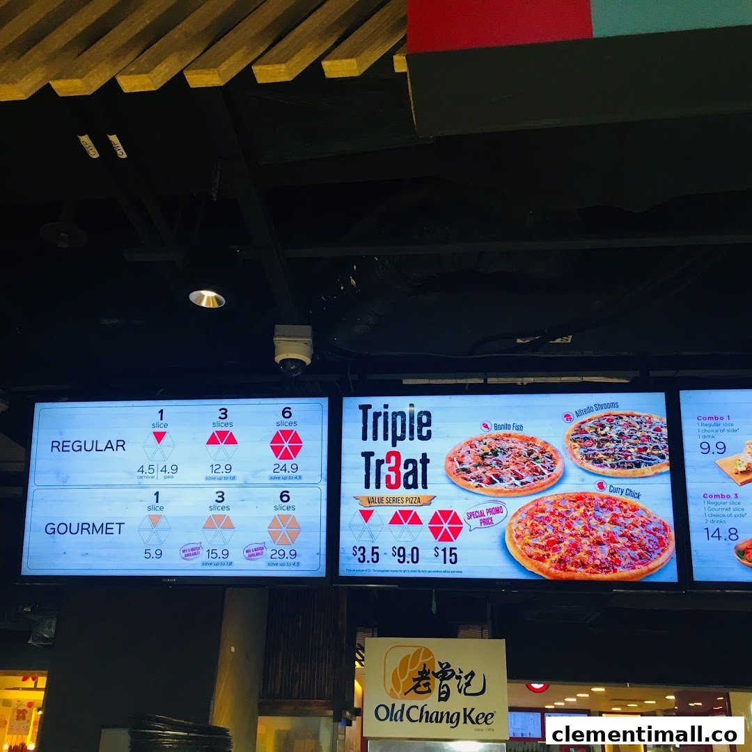 Digital menu boards displaying pizza slices, combos, and value series options with prices.