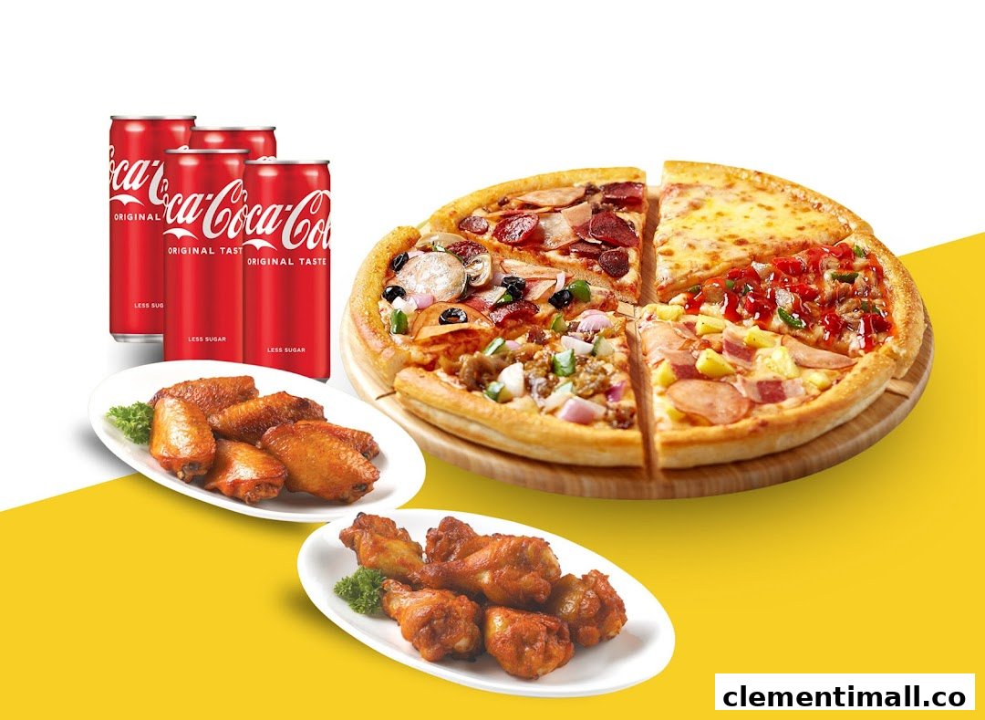 A vibrant image showcasing a multi-flavored pizza, crispy chicken wings, and Coca-Cola cans.