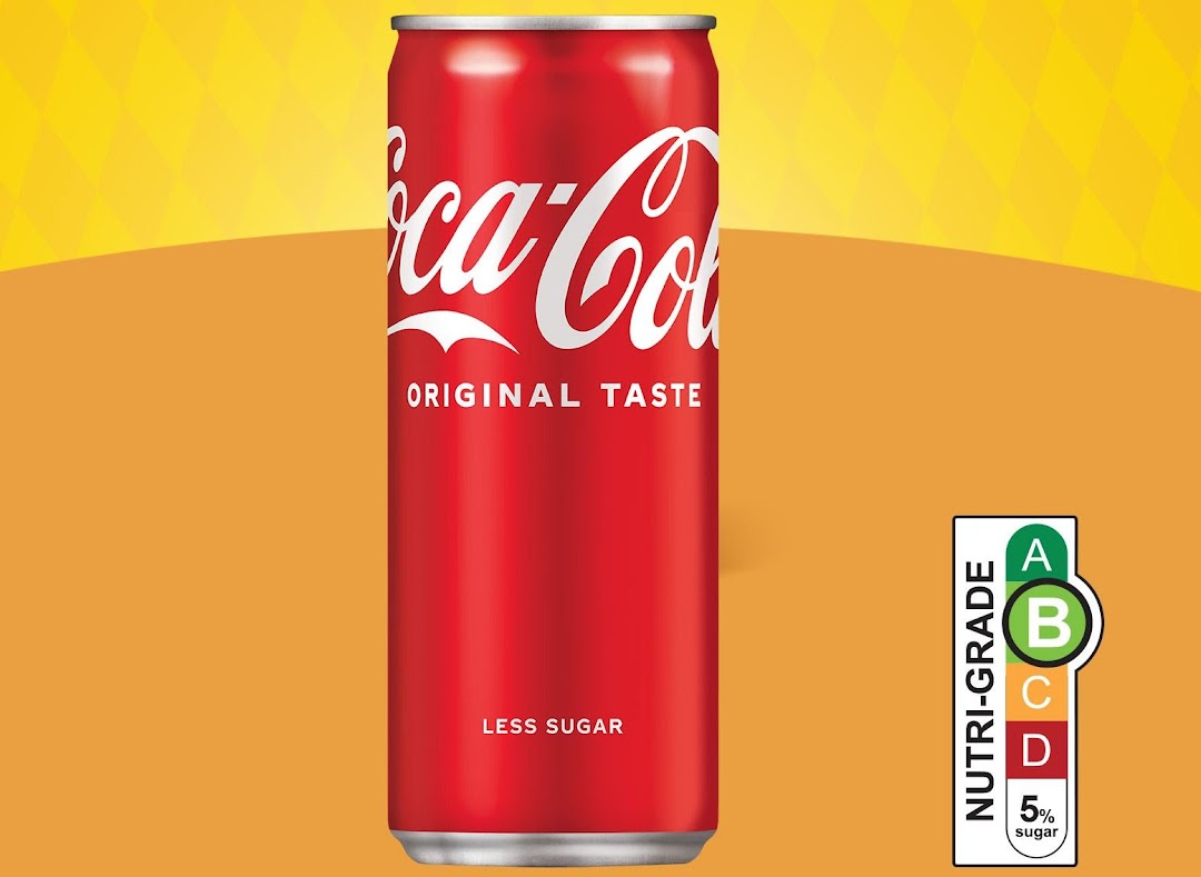 A red Coca-Cola Original Taste can with 'Less Sugar' and Nutri-Grade B label.