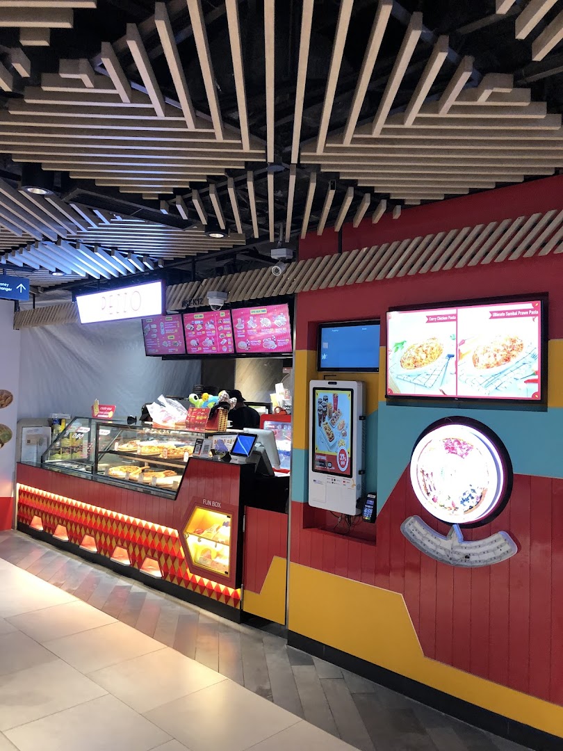Pezzo pizza counter featuring fresh pizzas in display cases and vibrant digital menu screens.