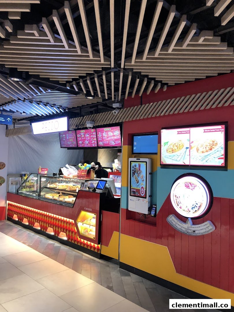 Pezzo pizza counter featuring fresh pizzas in display cases and vibrant digital menu screens.