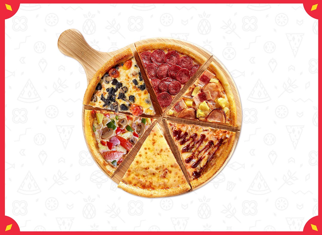 A large pizza on a wooden board, cut into six slices, each with a different topping.