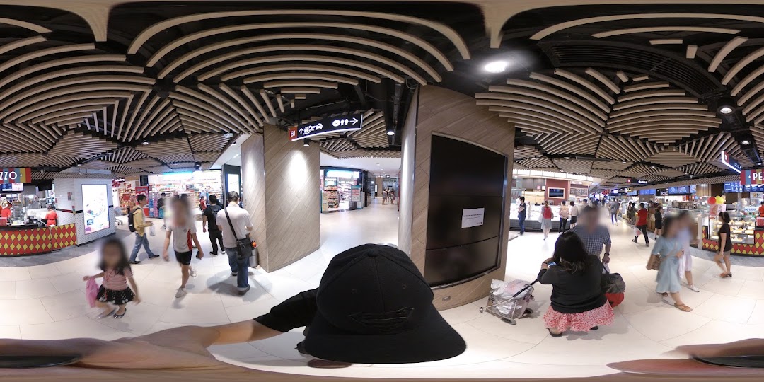 A bustling mall interior featuring the Pezzo pizza stall and shoppers.