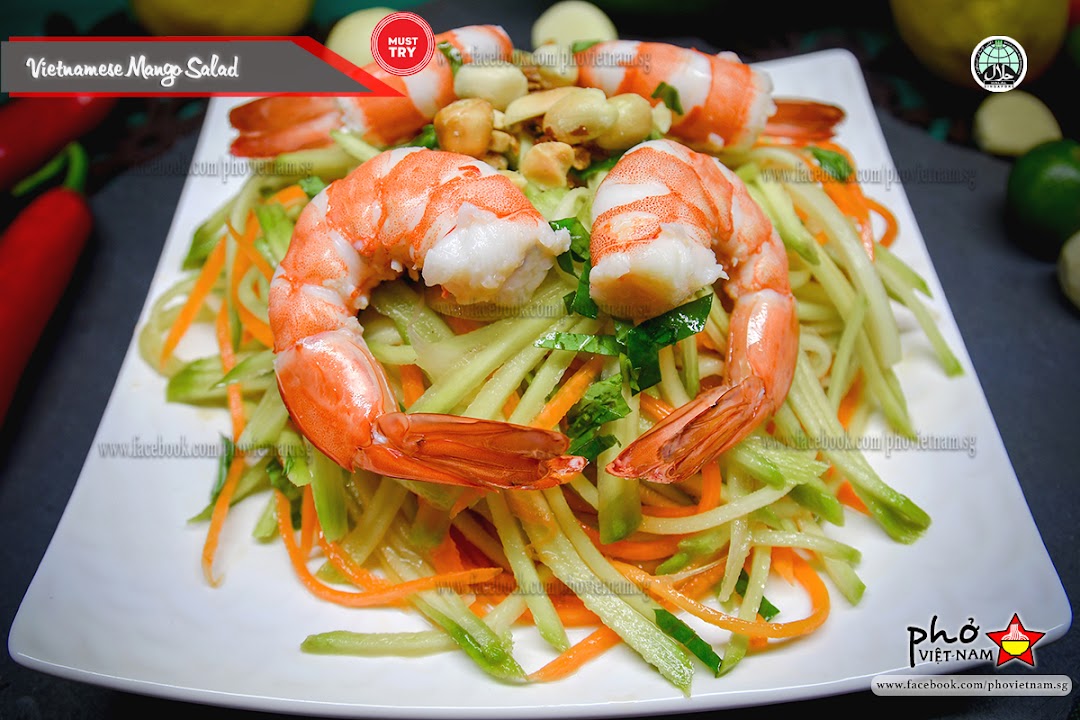 A vibrant Vietnamese Mango Salad with succulent shrimp and fresh vegetables.