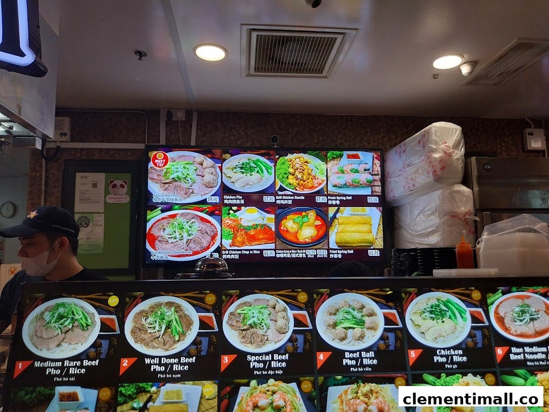 A vibrant digital and physical menu display showcasing various Vietnamese pho, noodle, and rice dishes.