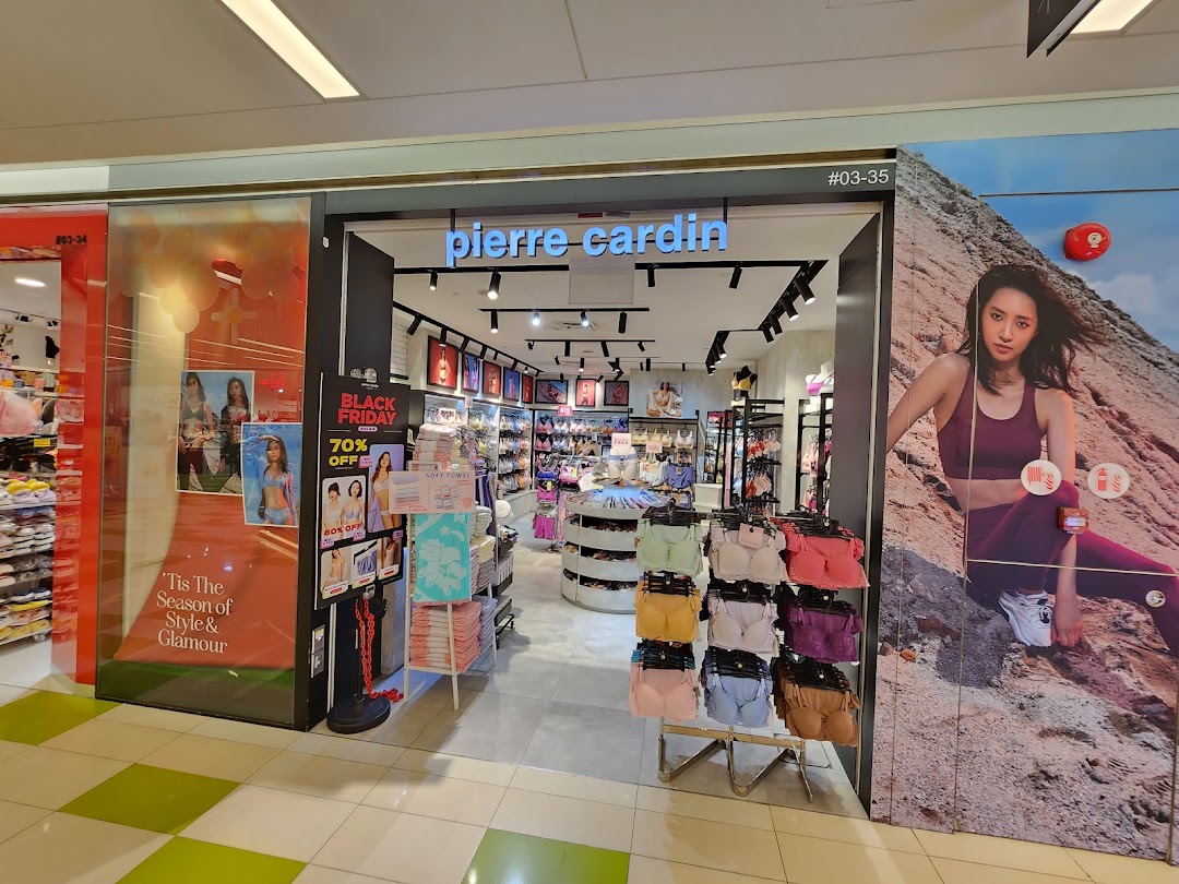 The shop front of Pierre Cardin Lingerie, featuring displays, promotional signage, and interior view.