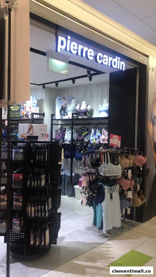 The image shows the brightly lit entrance of Pierre Cardin Lingerie, displaying various bras and undergarments.
