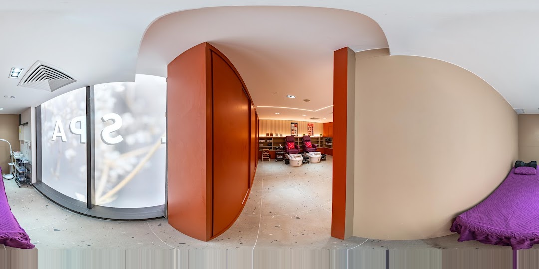 Interior view of Pixie Nail Spa, showcasing pedicure stations, a treatment bed, and a frosted window.