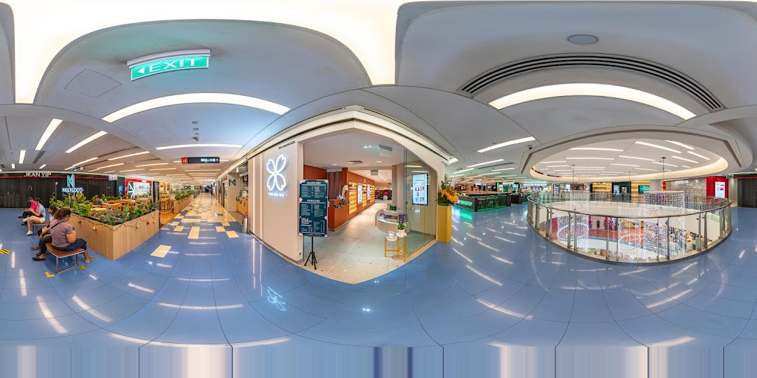 The inviting entrance of Pixie Nail Spa at The Clementi Mall, showcasing a prominent service price list.