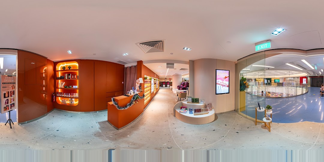 A panoramic view of Pixie Nail Spa's inviting interior, featuring product displays, reception, and treatment areas.
