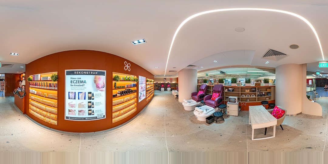 Interior view of Pixie Nail Spa, featuring comfortable pedicure stations and a wide range of nail care products.