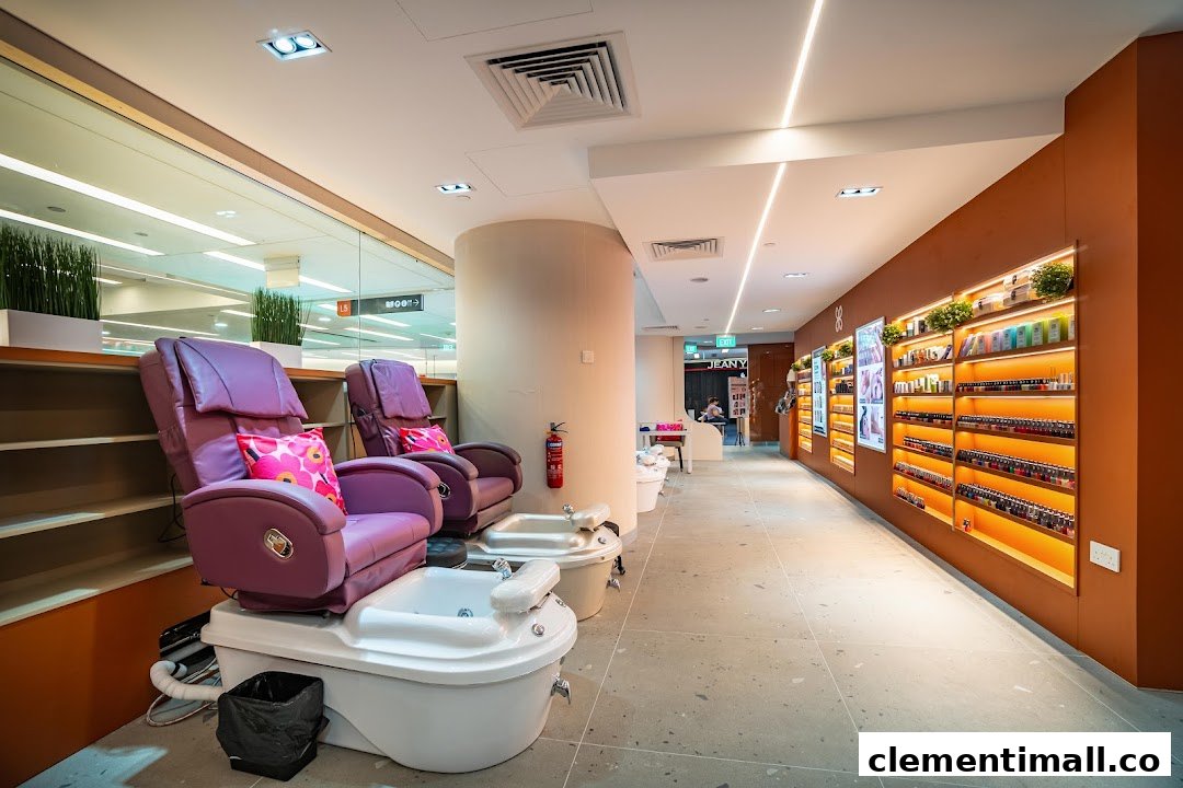 Interior view of Pixie Nail Spa featuring comfortable purple pedicure chairs and illuminated nail polish displays.