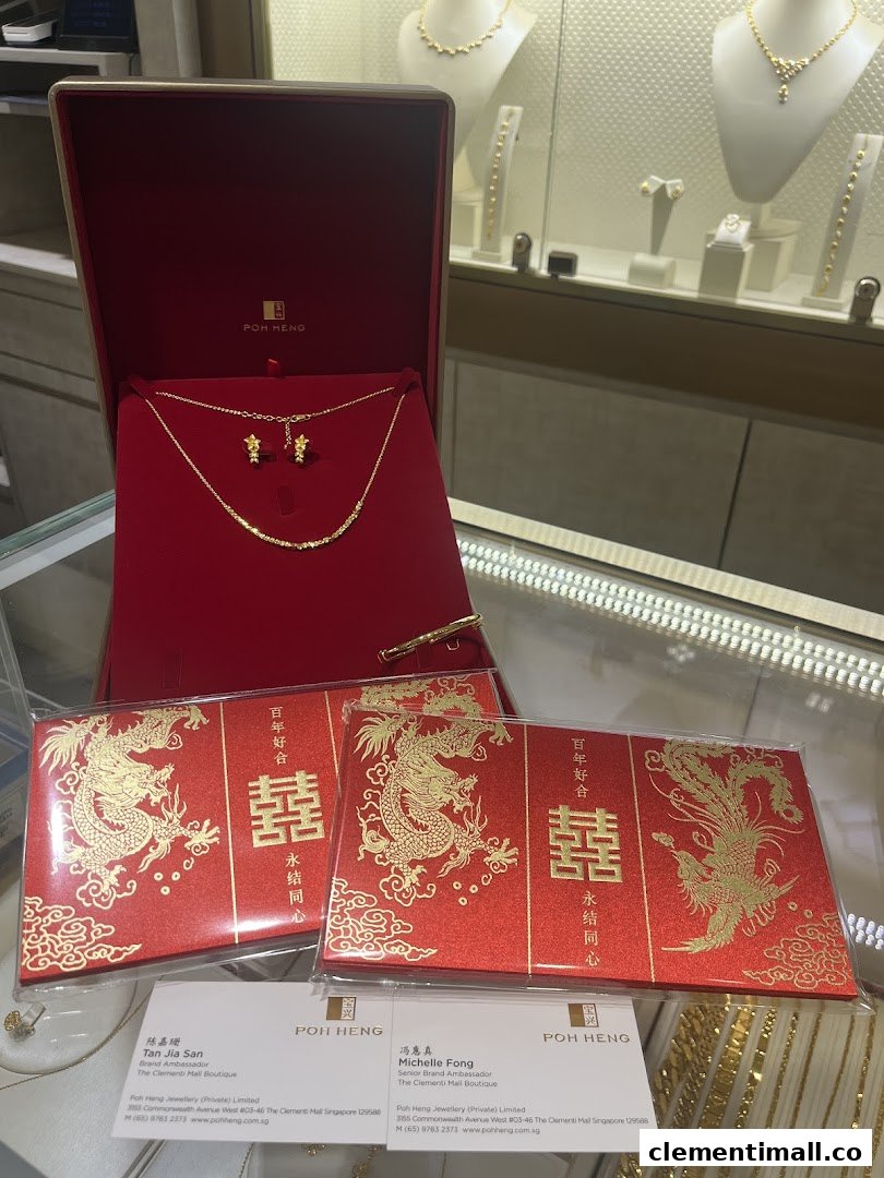 A gold necklace and earrings set in a red velvet box, accompanied by traditional red packets, displayed in a jewelry store.