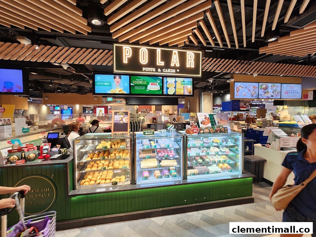 A vibrant display of pastries and cakes at Polar Puffs & Cakes, showcasing a variety of freshly baked goods.