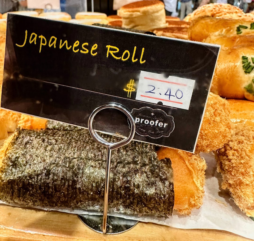 Close-up of a Japanese Roll pastry with its price tag at Proofer Boulangerie.