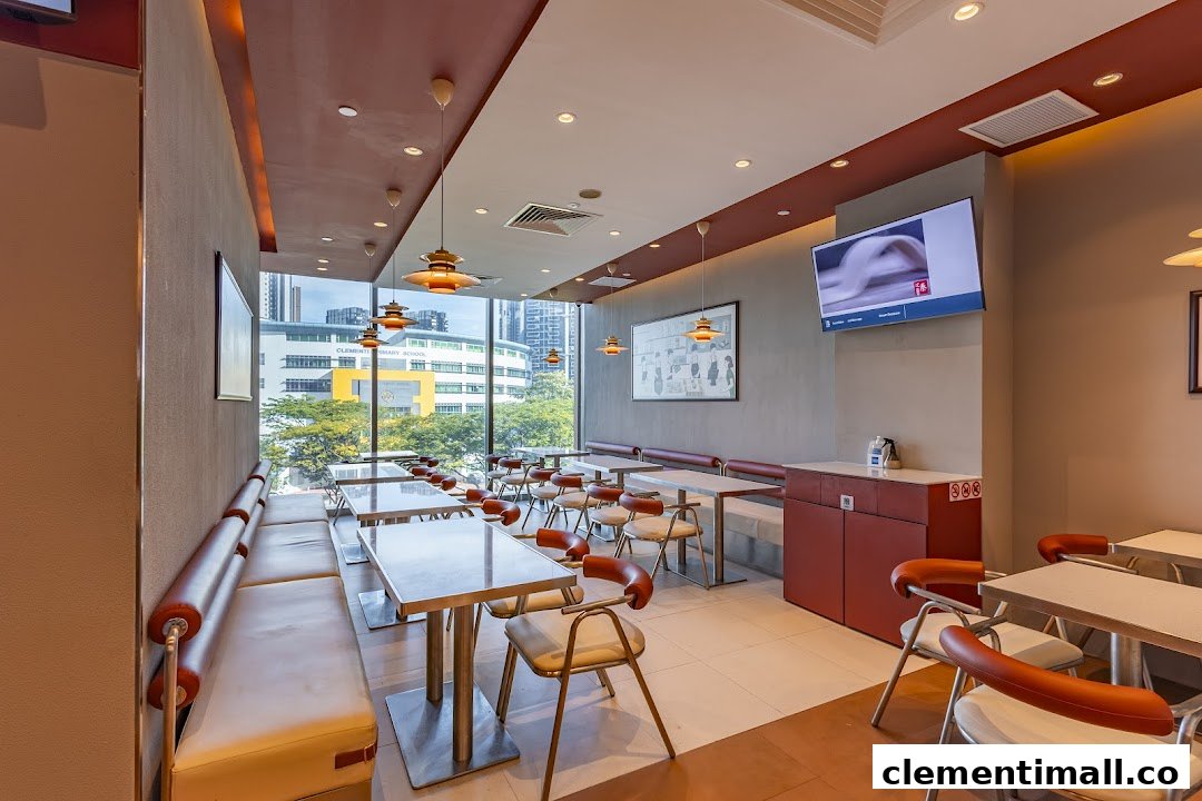 Bright and spacious interior of Qin Ji Rougamo with ample seating, large windows, and modern decor.