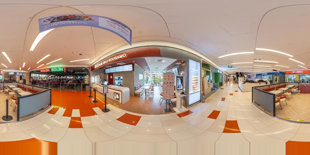 A panoramic view of Qin Ji Rougamo's interior, featuring its counter, seating area, and mall surroundings.