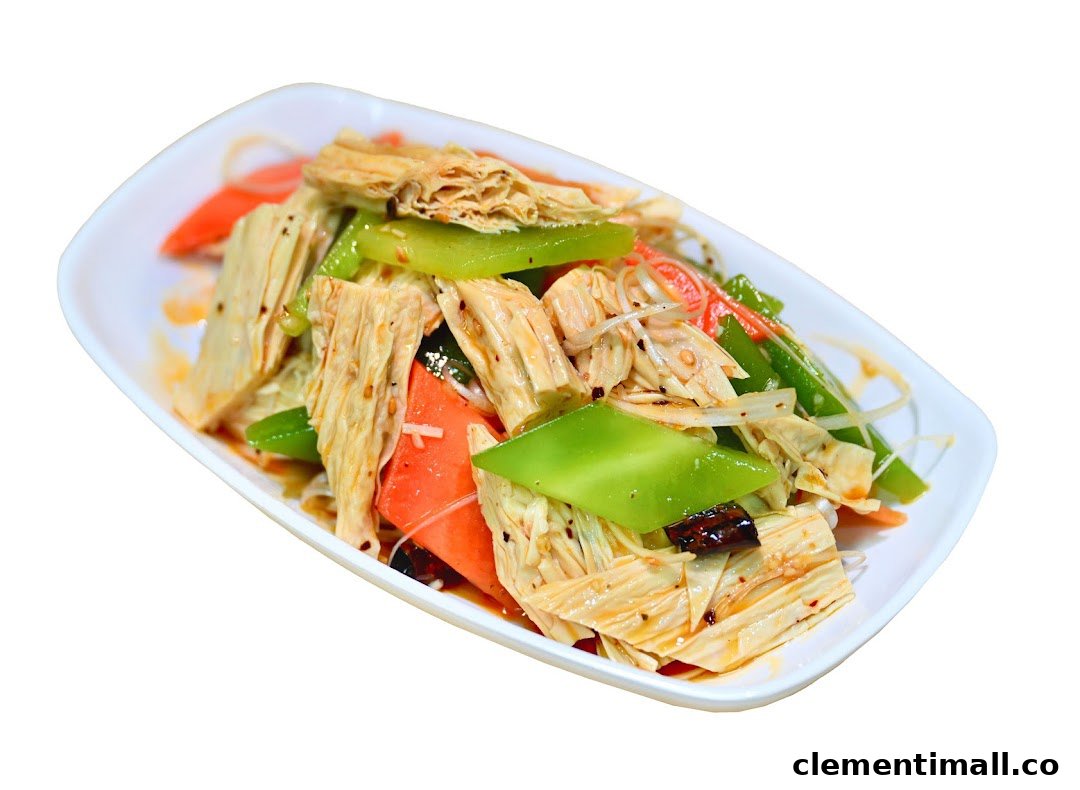 A vibrant cold appetizer featuring tofu skin, green peppers, and carrots in a savory sauce.
