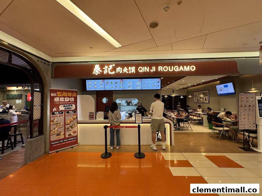 The shopfront of Qin Ji Rougamo, featuring its entrance, counter, and customers dining inside.