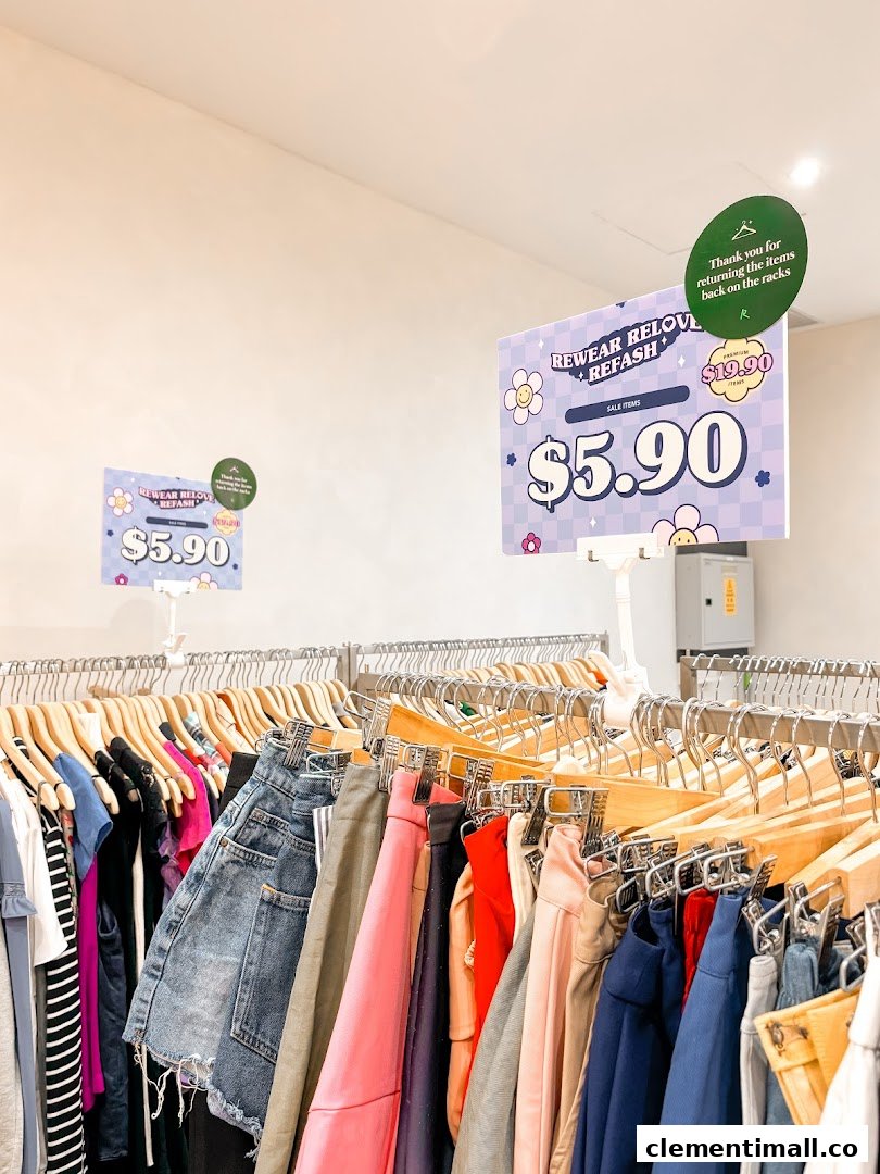 Racks of pre-loved clothing with sale signs indicating items priced at $5.90.