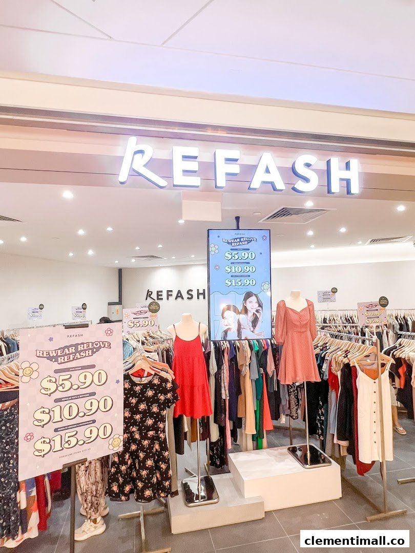 The bright entrance of REFASH, a fashion store, showcasing clothing displays and promotional signs.