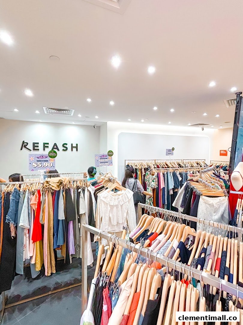 Interior view of REFASH, showcasing numerous racks of pre-loved clothing for sale.