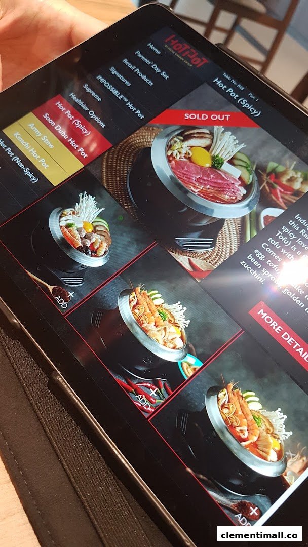 A digital menu displayed on a tablet, showcasing various hot pot options with images and descriptions.