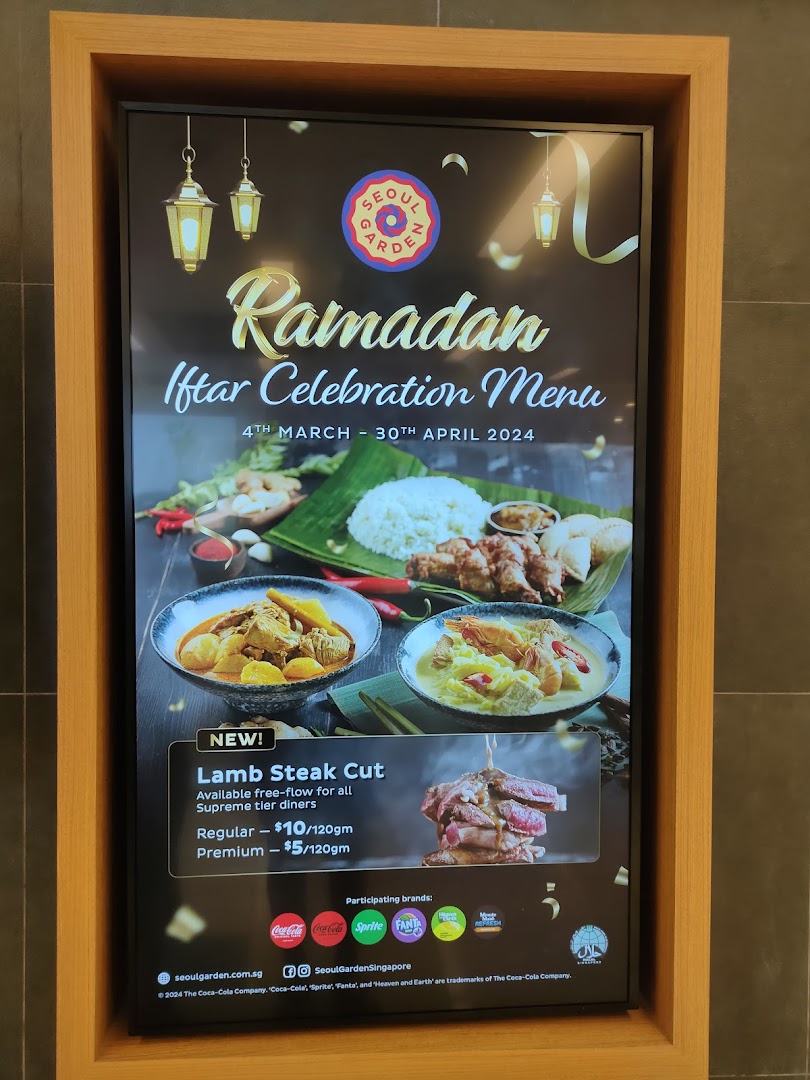 Digital display showcasing Seoul Garden's Ramadan Iftar Celebration Menu with a special Lamb Steak Cut offer.