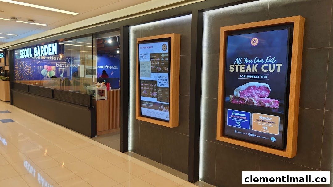 The entrance of Seoul Garden showcasing digital displays with buffet and all-you-can-eat steak promotions.