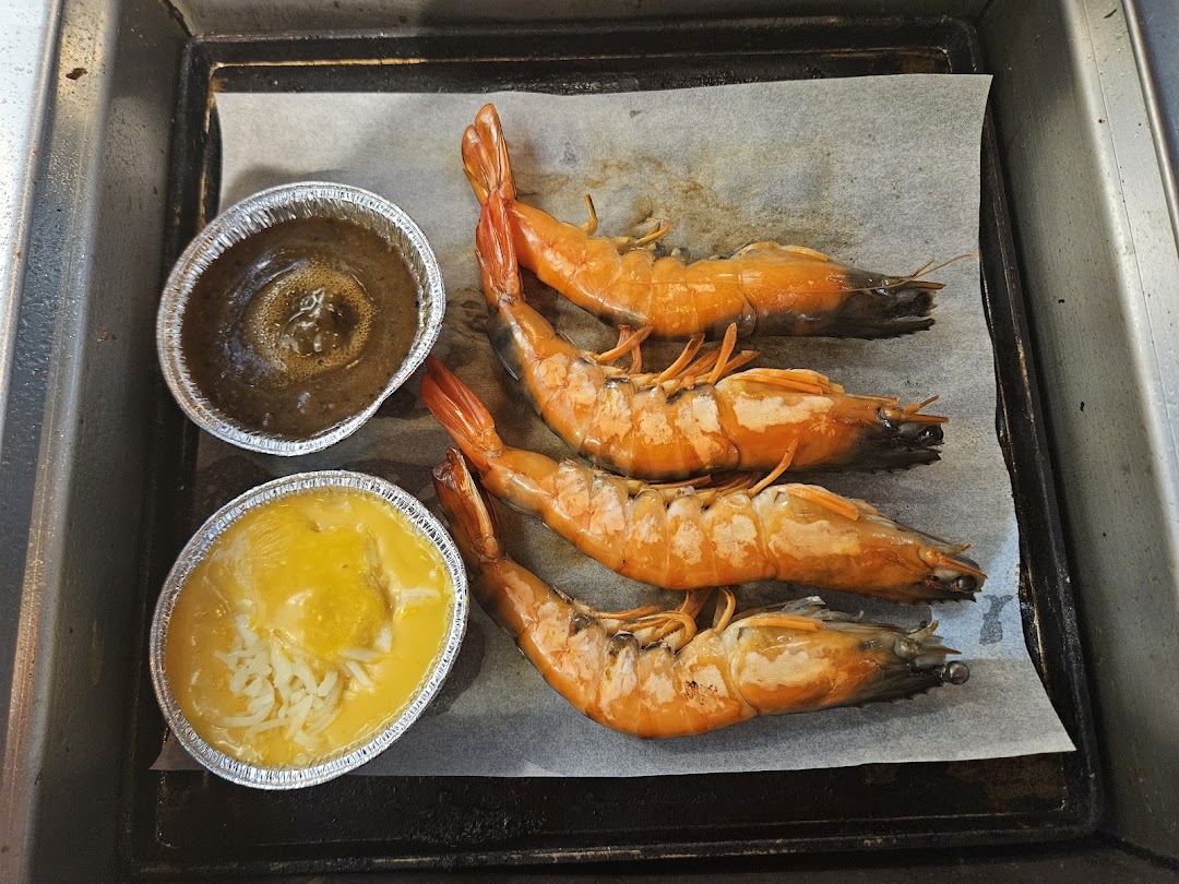 Delicious grilled prawns with dipping sauces, ready to be enjoyed at Seoul Garden.