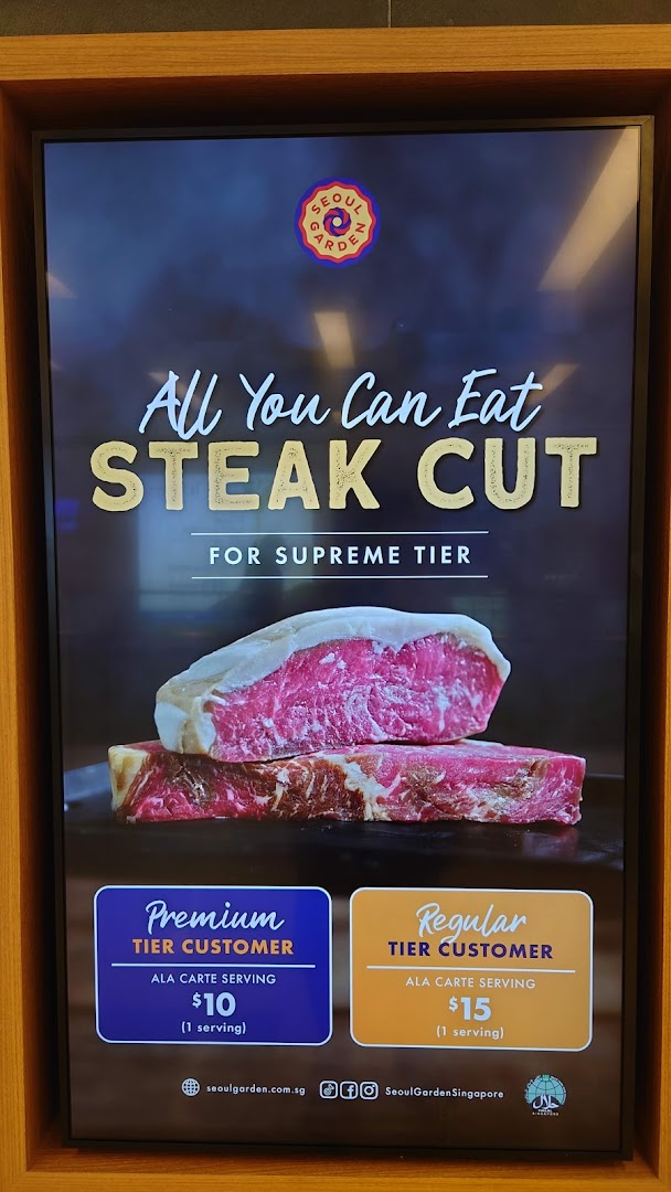 A digital menu board displaying an 'All You Can Eat Steak Cut' promotion with tiered pricing for Seoul Garden.