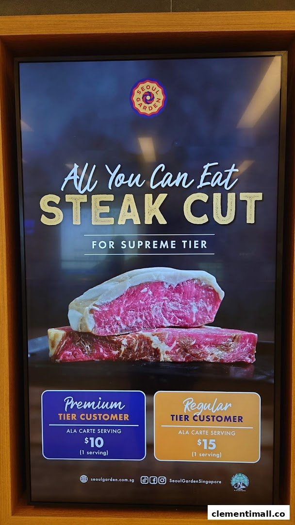A digital menu board displaying an 'All You Can Eat Steak Cut' promotion with tiered pricing for Seoul Garden.