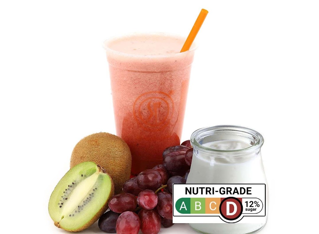 A vibrant smoothie with fresh kiwi, grapes, and yogurt, highlighting healthy ingredients and Nutri-Grade.