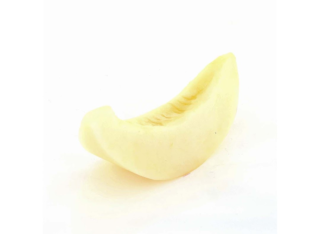 A single, pale yellow slice of honeydew melon on a clean white background.