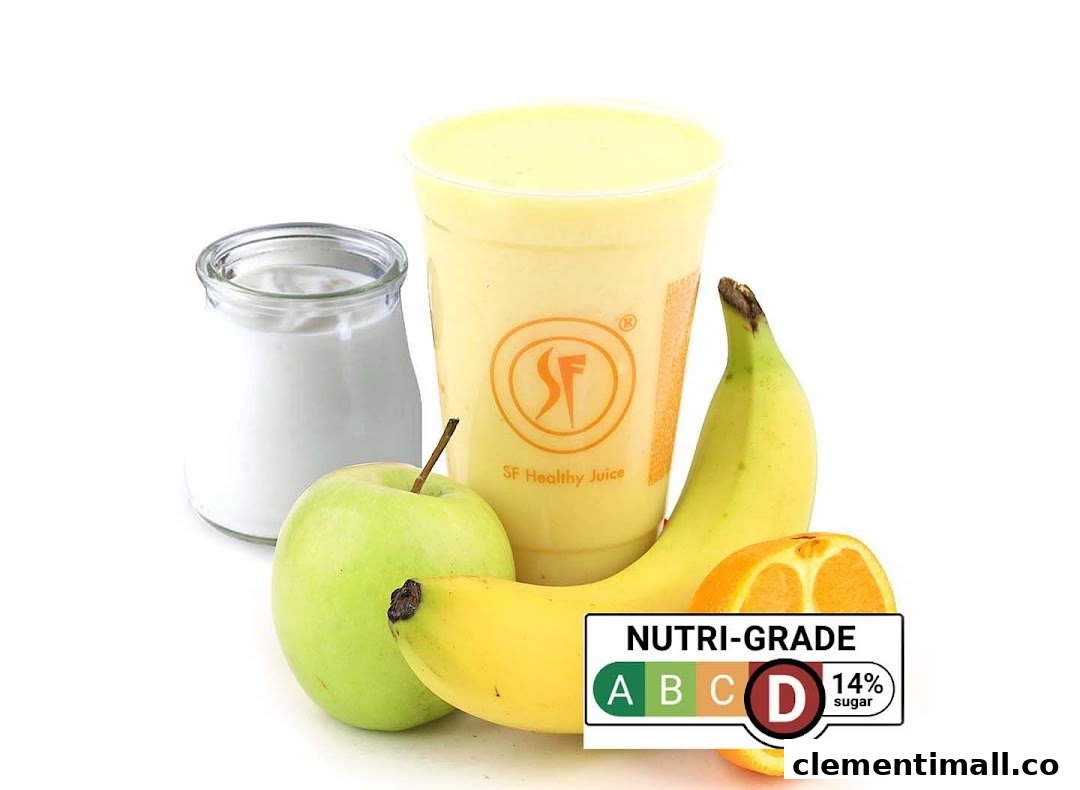 A vibrant fruit smoothie with fresh apple, banana, and orange, featuring a Nutri-Grade D label.