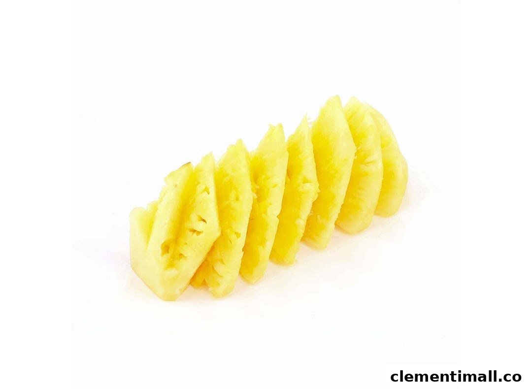 Bright yellow pineapple slices arranged neatly on a clean white background.