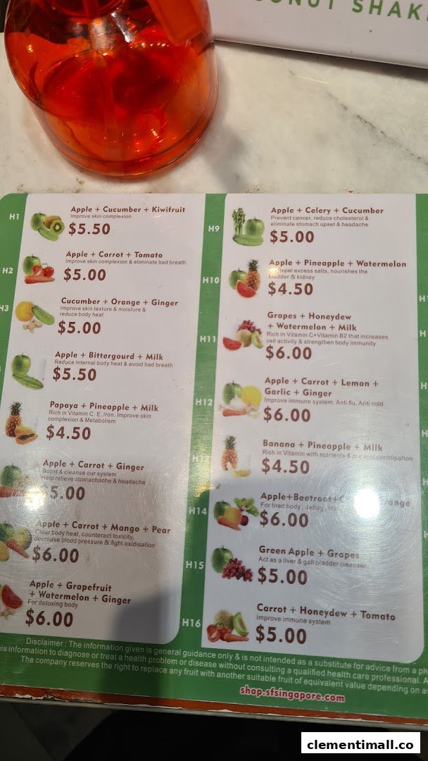 A detailed menu board displaying various fruit and vegetable juice blends with their prices and health benefits.