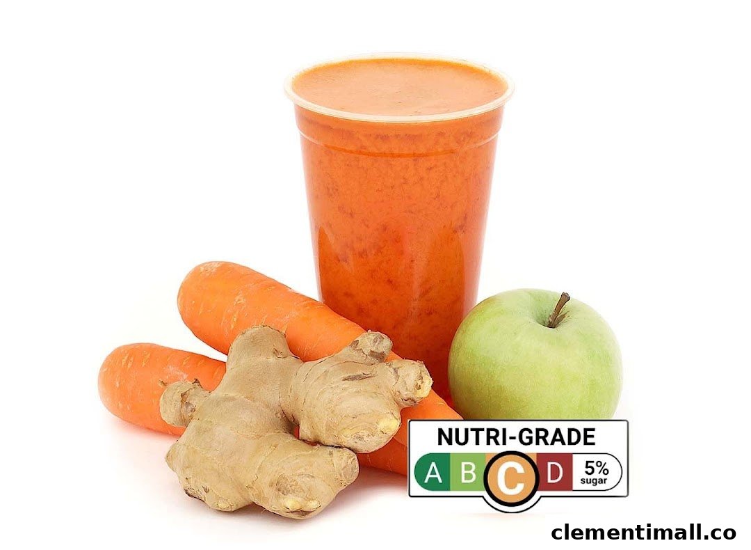 A vibrant orange juice with carrots, ginger, and an apple, featuring a Nutri-Grade C label.