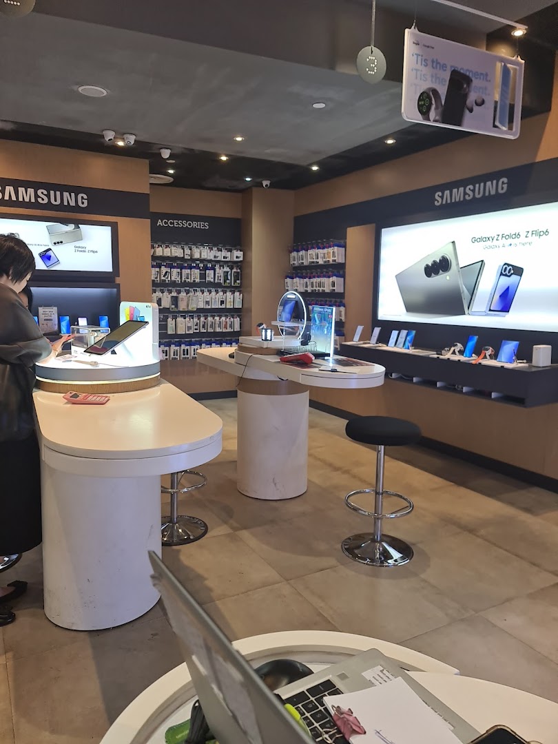 An interior view of a Singtel Exclusive Retailer, showcasing Samsung phones and accessories.