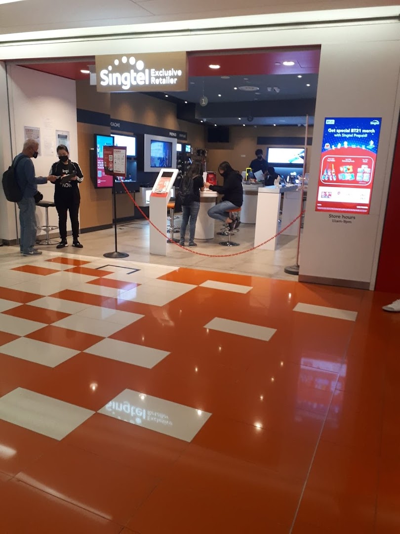 The entrance of a Singtel Exclusive Retailer store with customers and staff inside.