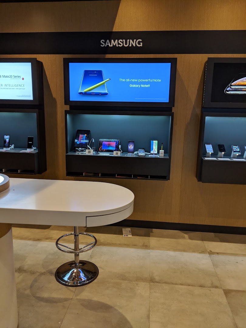 An interior shot of Singtel's retail space showcasing Samsung mobile devices and a promotional display.