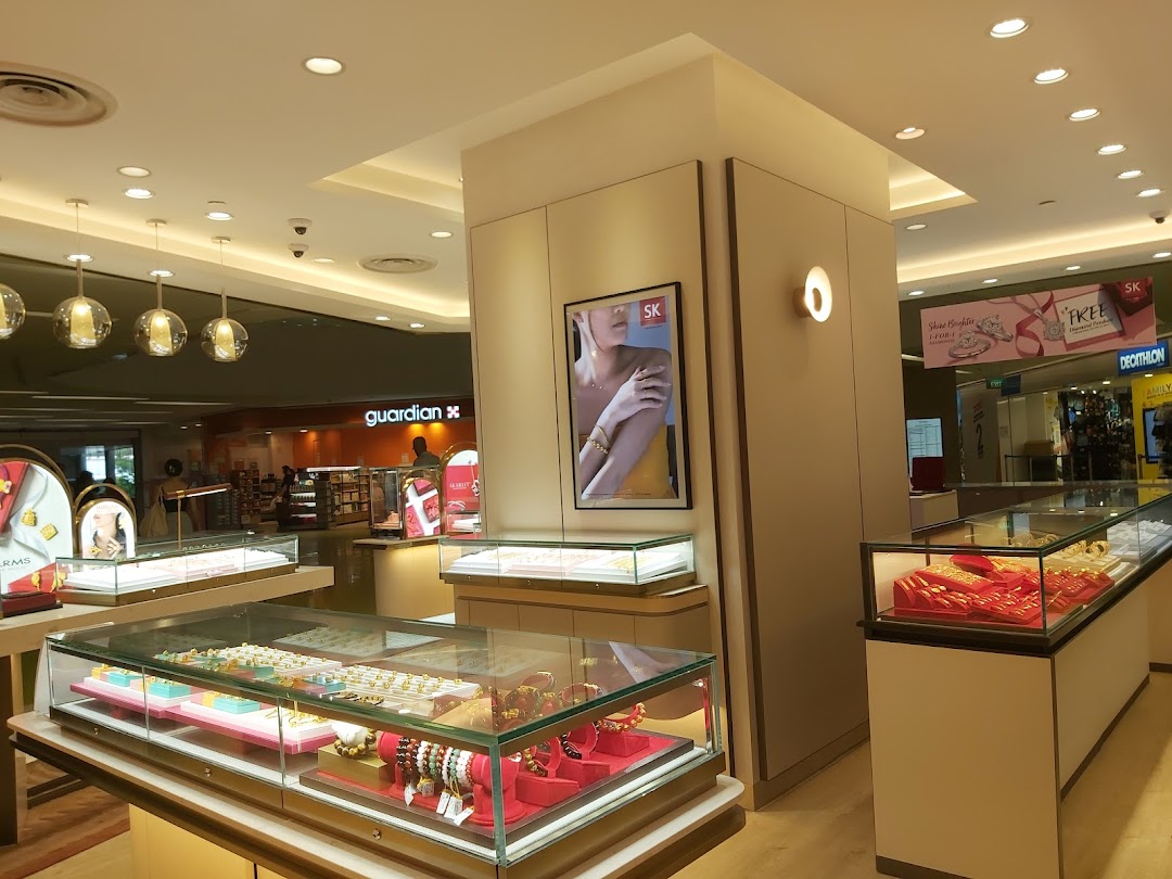 Interior view of SK Jewellery showcasing elegant display cases filled with a variety of exquisite gold and gemstone jewellery.