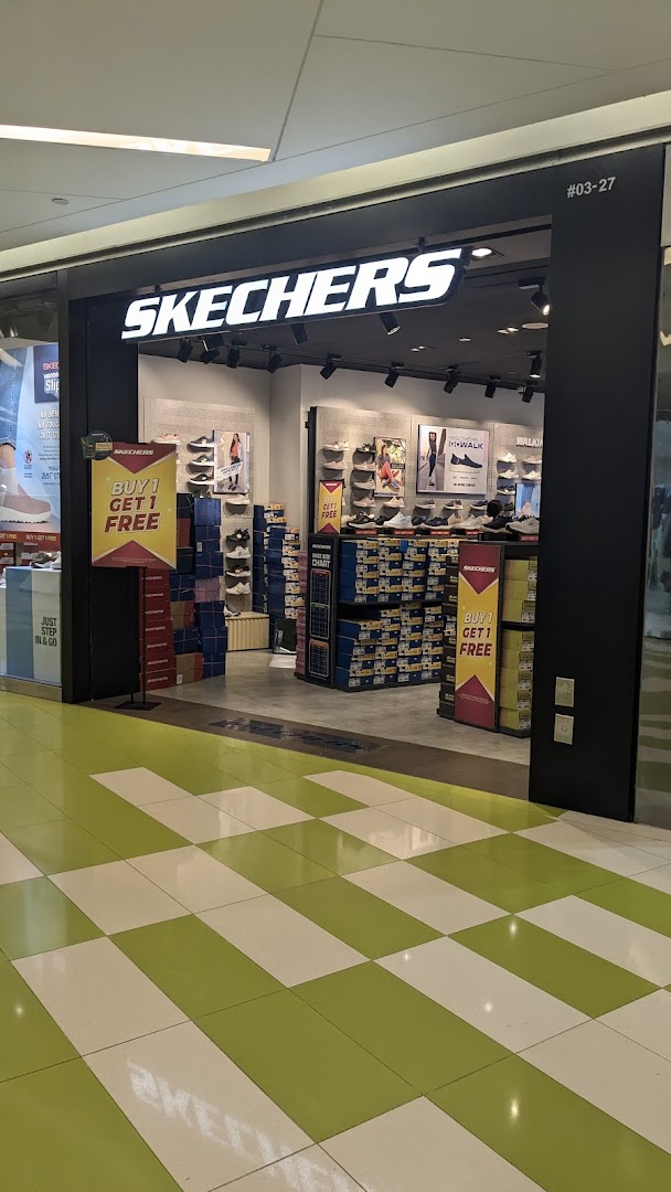 The entrance of a Skechers store featuring a 'Buy 1 Get 1 Free' promotion and shoe displays.