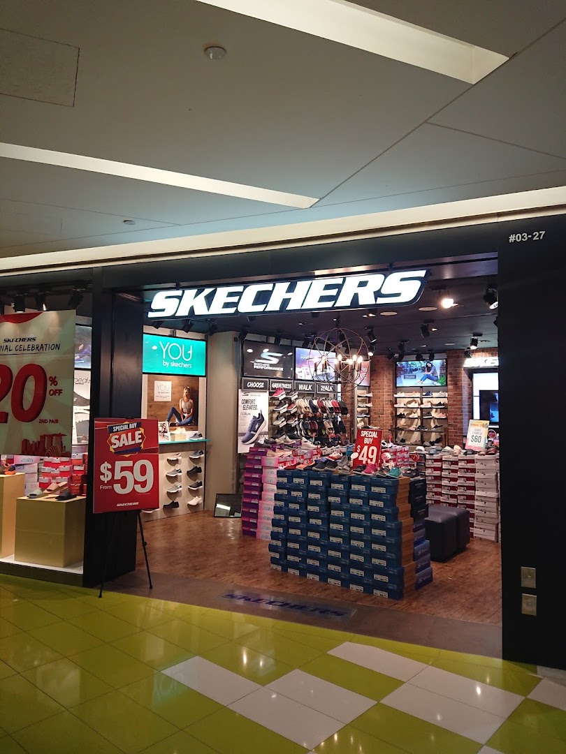 The Skechers storefront features a bright entrance, promotional displays, and stacked shoe boxes.